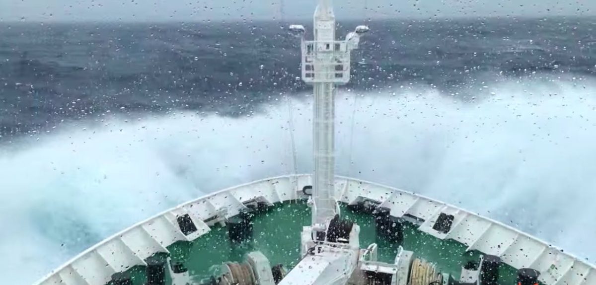 A ship sailing across the Drake Passage in rough seas